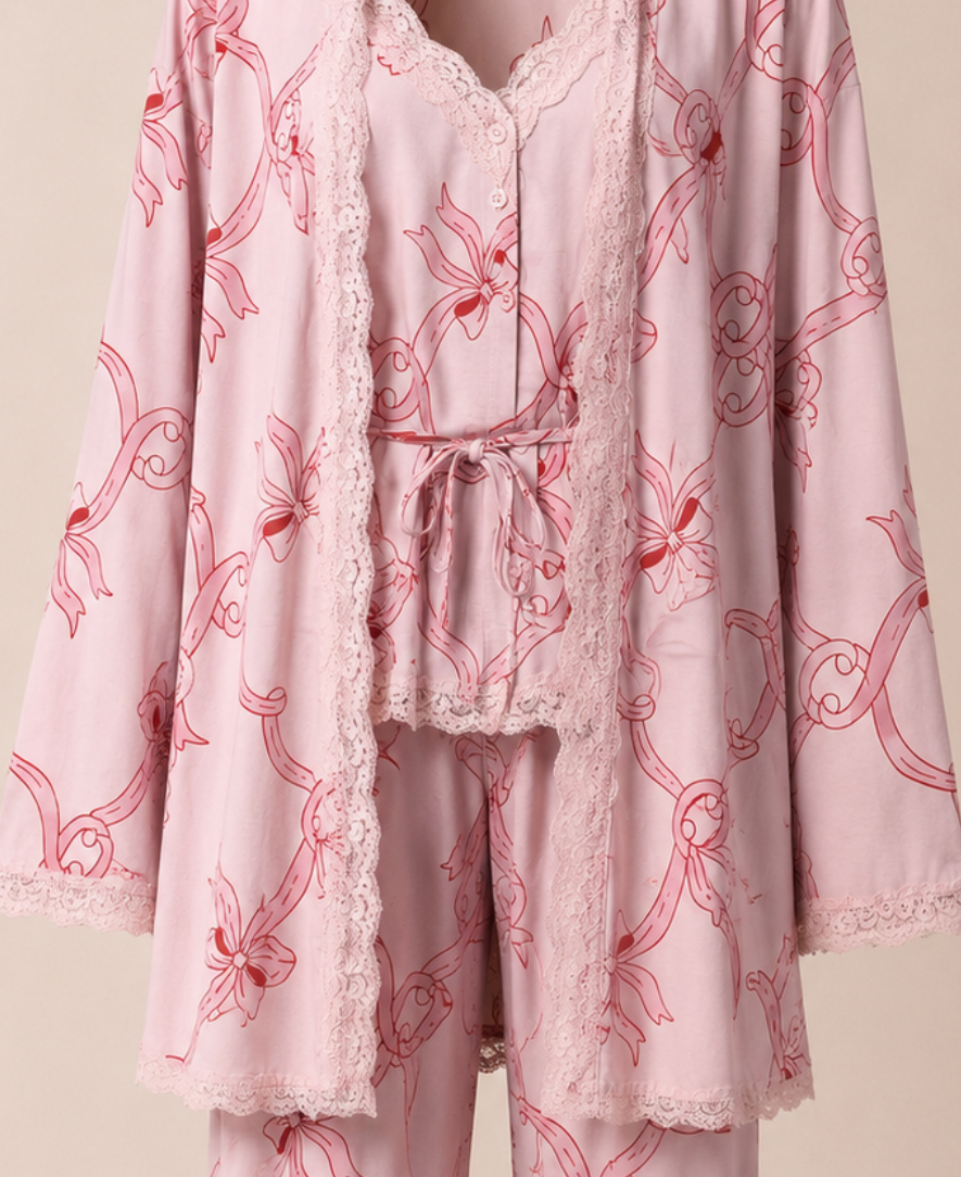 Pink pajama set with floral pattern on a beige background