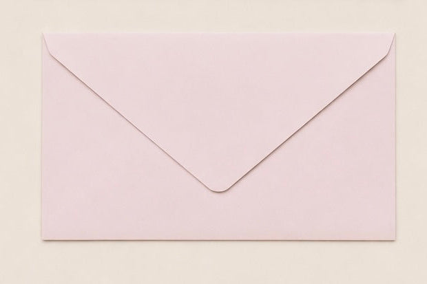 Pink/beige envelope on a light beige background