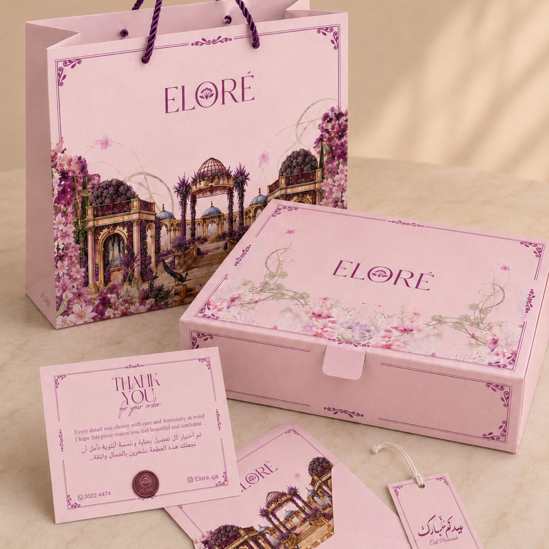 Elorè branded packaging set including a box, bag, card, and tag on a beige background.